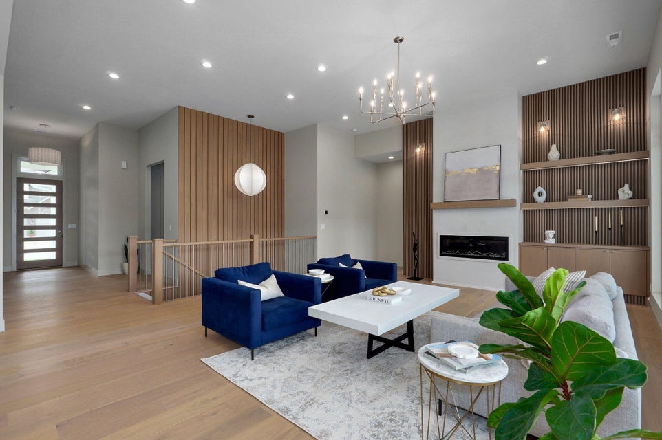 Luxury living room with custom built-in cabinetry by Millwood